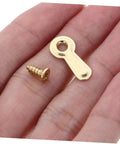 Heavy Duty Iron Picture Frame Backing Clips Featuring Quick Turn Button Fasteners And All Included Mounting Screws For Hanging Wall Photos Artwork Crafts Straight Up No Sweat, close-up of gold screw and clip in hand.