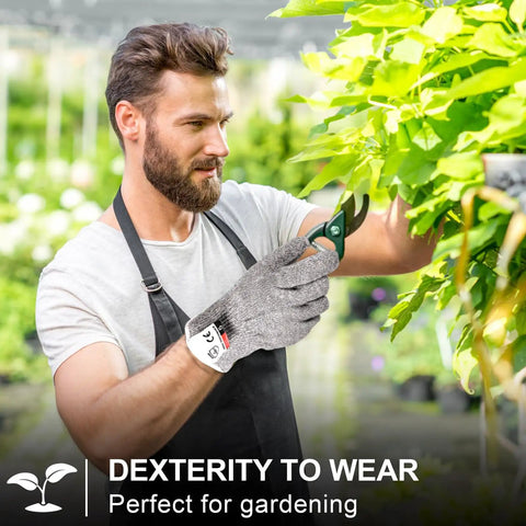Man wearing cut resistant gloves trimming plants, showcasing Twenty Pairs Cut Resistant Gloves Level 5 Protection For Kitchen Safety And DIY Chopping Slicing Heavy Duty Anti Cut Gloves For Kitchen Use And Garden Projects Comfortable Flexible Fit.