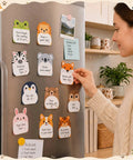 Person using Dope 24 Pack Cartoon Animal Sticky Notes Set With 1152 Sheets on refrigerator in kitchen setting.