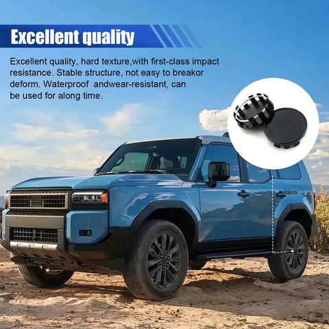 Upgrade Your Whip With These Slick Black Wheel Center Caps Providing Easy Snap Fit Mounting To Keep Rust Off Your Rim Hubs While Keeping Your Daily Driver Looking Tight On The Road. Image shows a blue SUV with black wheel center caps in a desert setting.