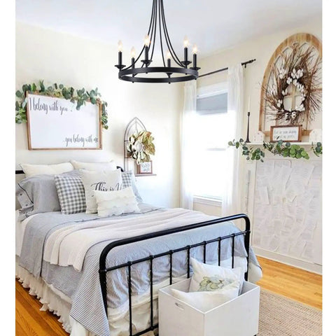 Black Farmhouse Wagon Wheel Chandelier With Six Lights, 24 Inch Rustic Pendant Ceiling Light in cozy bedroom setting