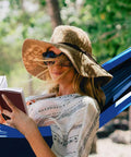Woman relaxing in Two Person Double Camping Hammock With Lightweight Parachute Nylon 210T, reading in a shaded garden