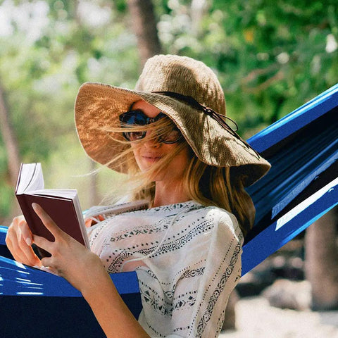 Woman relaxing in Two Person Double Camping Hammock With Lightweight Parachute Nylon 210T, reading in a shaded garden