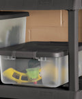 18 Pack Plastic Storage Bins With Lids 25 Quart Gray Shelf Totes Heavy Duty Durable Clear Containers Fits Standard Shelving Made In Usa on a shelf holding small toys.