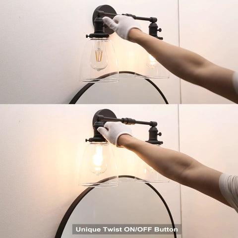 Person adjusting Retro Industrial 2-Light Wall Sconce Set With Dual 5.6 Inch Bell Shaped Clear Glass Lampshades, Black Finish
