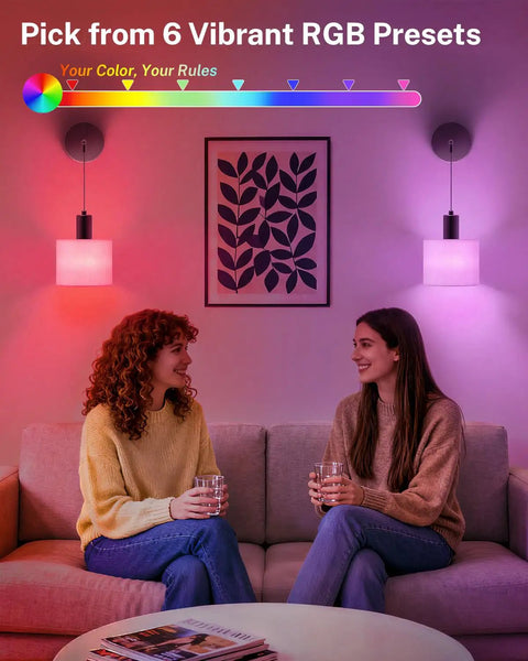 Two women sitting under Cordless Battery Operated Wall Sconces Set Of 2 With Remote Control, showing vibrant RGB lighting effects.
