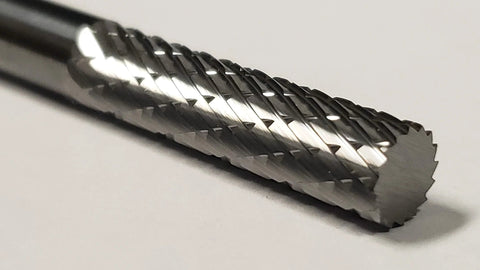 Close-up of One Fourth Inch Cylinder Double Cut Solid Carbide Burr SA-1L For Metalworking And Jewelry Making, showing carbide cutting edges.