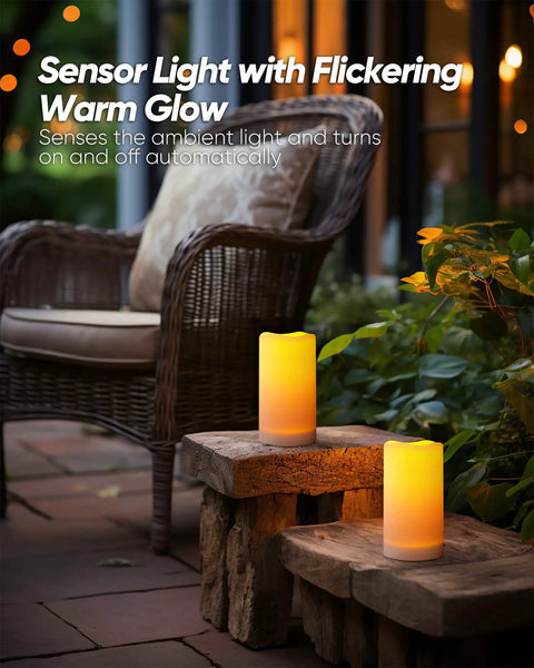 Lit Outdoor Solar Pillar Candles 3x6 Inches Waterproof on patio with dusk-to-dawn sensor flickering near chair for Halloween decor