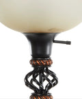 Close-up of Antique Style Torchiere Floor Lamp in Black Finish with glass accents, iron detailing, sleek and dope look.