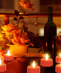 Three Pack Flameless Battery Operated LED Candles With Embedded Starlight String Lights on festive table with flowers