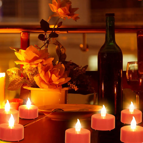 Three Pack Flameless Battery Operated LED Candles With Embedded Starlight String Lights on festive table with flowers
