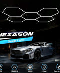 Hexagon LED Garage Light Hella Bright 168W 6500K 18480 Lumens Five Grid Panel in garage with car at auto shop