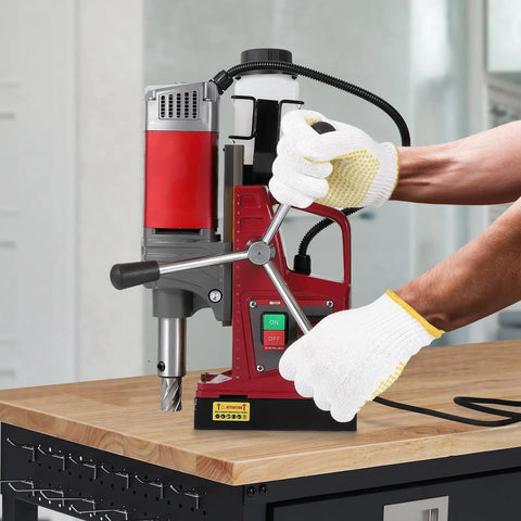 Heavy Duty Magnetic Drill Press With 1450W Motor And Strong 13000N Base being operated with gloves for precise metal boring.