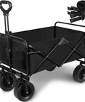 Foldable Wagon Cart With Big All Terrain Wheels And Drink Holders For Beach Camping Fishing Gardening Sports And Shopping Heavy Duty Frame Carries Up To 330 Pounds, black, in side view with straps
