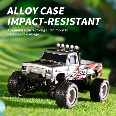 One Sixty Fourth Scale Mini Remote Control Monster Truck With Trailer, shown outdoors, highlighting alloy body and rugged tires.