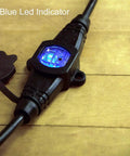 Beefy 50ft 12 Gauge Outdoor Extension Cord With Eleven Outlets showing LED indicator and end connector on wooden surface