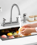 Swanky Two Handle Kitchen Faucet With Pull Out Side Sprayer And Tall High Rise Arc Finished In Brushed Nickel for cleaning fruits.