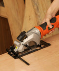 Heavy Duty Mini Circular Saw With Beefy 4 Amp Motor And Crisp Laser Sight For Dang Clean Cuts On PVC Laminate Drywall And 2x4s Featuring Slick Dust Collection Port in use on wood.