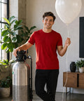 Helium Balloon Filler Regulator With Gauge 0-3000 PSI For CGA580 Tank used by person holding a white balloon indoors.