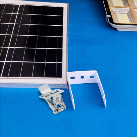 Bingche 20 Pcs Spring Clips for Recessed Lighting, Panel Lamp Ceiling Light Retaining Clamps beside a solar panel on blue surface.