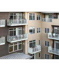 Outdoor Wall Light LED 13 Inch Textured Black With Integrated 3000K Glow on modern apartment building