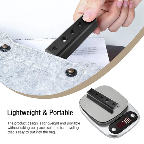 Finderscope Dovetail Mount Plate for Telescopes on digital scale next to grey fabric, showing lightweight and portability.