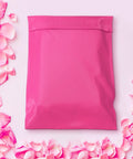 Cute Pink Poly Mailers 14.5 By 19 Inches 500 Pack Self Seal Waterproof Tear Resistant Shipping Envelopes For Clothing And Soft Goods Great For Online Stores And Easy Returns in a floral setting.