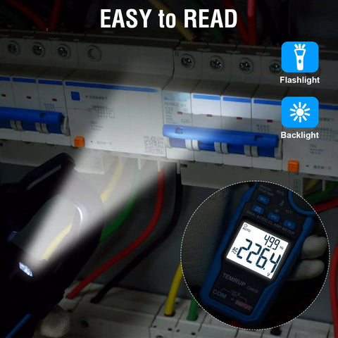 All In One Handy Clamp Meter Multimeter displaying AC voltage in a dimly lit electrical panel with flashlight and backlight features