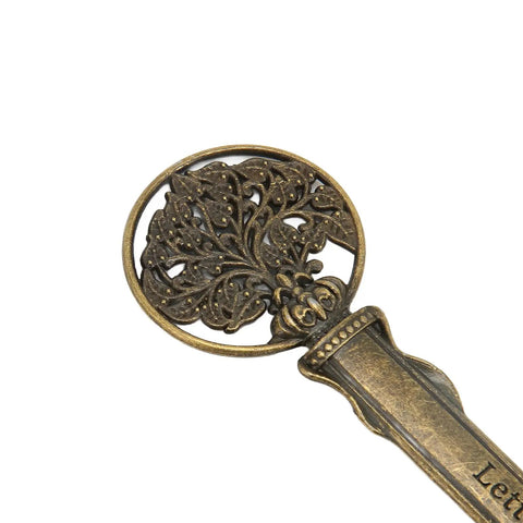 Sleek Zinc Alloy Letter Opener With Retro Pattern, Ergonomic Handle, showing detailed ornate design at the top