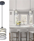 Sleek Modern Mini Pendant Light in kitchen, matte black spiral cage, handblown frosted glass shade, adjustable cord, dining room decor