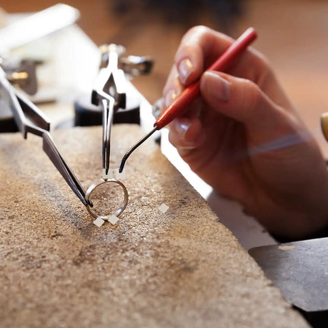Jeweler using tools on ring with Two Pack 2mm Silver Solder Sheet For Jewelry Making, DIY Soldering Supplies, Great For Repairs And Craft Projects, Works With A Wide Range Of Metals, Compact, Easy To Use, Pro Grade Silver Jewelry Craft.