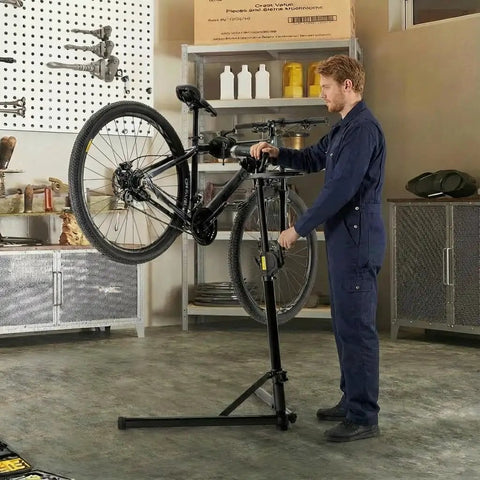 Mechanic using Heavy Duty Bike Repair Stand With Hand Crank Mechanical Lift, Max 110 Lbs Load, Aluminum Work Stand For E Bikes