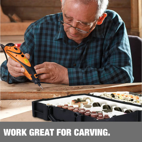 Man using rotary tool from Rotary Tool Accessories Kit Do-It-All 361 Pieces One Eighth Inch Shanks for carving on wood project.
