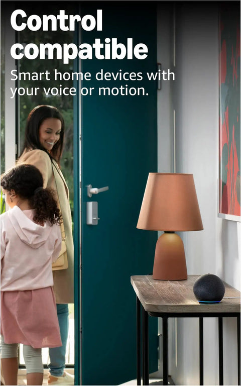 Echo Dot Newest Model With Rich Vibrant Sound Designed For Alexa on table in hallway with child and woman entering room