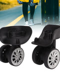 Rotatable Luggage Wheel Casters For Suitcases, durable nylon replacement parts, shown in front of suitcase on a road