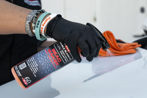 Bead Maker Paint Sealant For No Fuss Spray And Wipe Protection On Cars, Boats, And RVs With Hydrophobic Gloss And UV Defense Safe For All Surfaces One Gallon shown being sprayed on a surface.