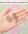 Compression Springs Set, 10 Pack Of 304 Stainless Steel Small Extension Springs, shown in a hand with floral background