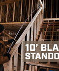 Person using Pro Grade Tape Measure Set With Sixteen Foot And Twenty Five Foot Dual Sided Blades MIL X Coated Case One One Eighth Inch Blade For Tough Durability High Visibility White Blade With Double Sided Markings Compact Layout Tool For Pros And DIY Projects on construction site, showcasing 10' blade standout