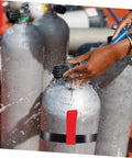 Person using a Red Scuba Tank Strap For Easy Carry And Quick Release Hose Retainer Side Mount Cylinder Rigging Belt For Dive Bottles.