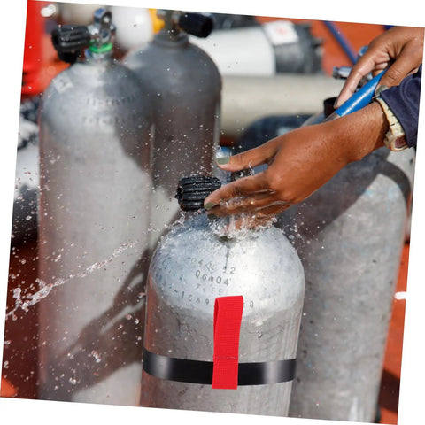 Person using a Red Scuba Tank Strap For Easy Carry And Quick Release Hose Retainer Side Mount Cylinder Rigging Belt For Dive Bottles.