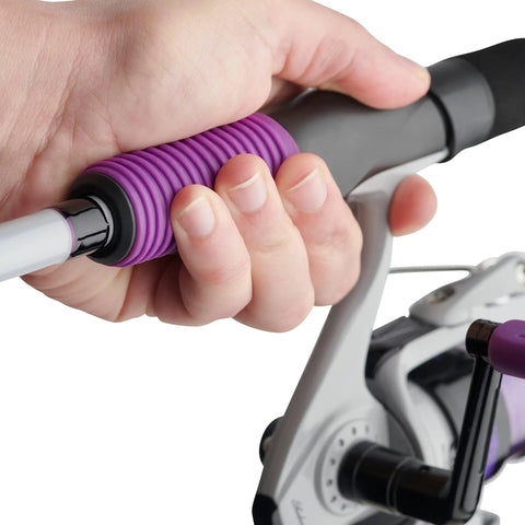 Close-up of hand holding Jellyfish Spinning Reel And Fishing Rod Combo In Purple 5 Foot 6 Inch Medium Two Piece Glass Rod with Gel Tech Grip.