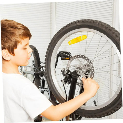 Child adjusting the Complete Front And Rear Mechanical Disc Brake Kit With Heavy Duty Rotors And Precision Calipers Plus All Mounting Bolts For Mountain Bikes Gnarly Trail Ready Setup