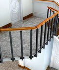 Rock Solid Stair Railing Kit With 270 Degree Adjustable Brackets And Heavy Duty Wrought Iron Banister Columns For Indoor Outdoor Deck Steps No Hassle Side Mount Install Set Of Four Posts, showcasing black iron posts and wood handrails.