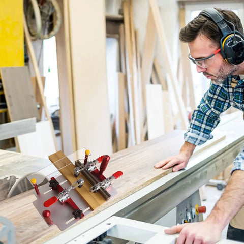 Woodworker uses Coping Sled for Router Table With Clear Acrylic Fence, Rail Guide, Safety Pushing Clamp for precise joints.