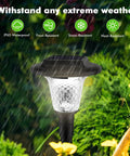 8 Pack Glass Solar Outdoor Lights With 1000mAh Solar Panel Warm White Color Changing Modes For Pathways And Walkways Backyard Lawn Garden Waterproof Glass Shade illuminating in rain.