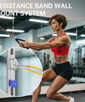 Woman using Rock Solid One Piece Resistance Bands Wall Anchor Adjustable Exercise Platform Base in gym, demonstrating strength training.