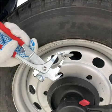 Person using Heavy Duty Wheel Weight Pliers And Tire Balancing Tool For Cars, SUVs And Trucks Clip On Weight Remover And Installer With Hammer Function Textured Rubber Handle Alloy Construction 12 Oz Weight on tire rim close-up