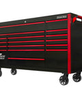 Massive Seventy Two Inch Rolling Tool Chest With Seventeen Deep Drawers Magnetic Locking Wheels Professional Grade Garage Workstation In Tough Black Build Featuring Classic Red Pulls showing side view with spacious drawers.