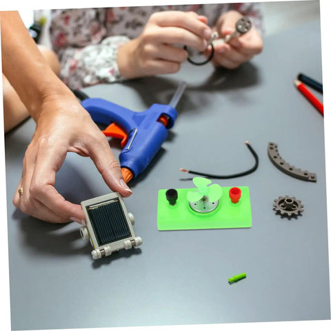 Hands assembling Dc Motor Diy Kit For Mini Wind Turbine Electric Generator Solar Powered Physics Project for science experiments