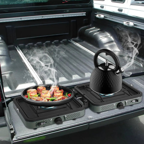 Two-Burner Propane Camp Stove With Grill And Carrying Bag, Ready-To-Go Portable Folding Stove With 17000 BTU Adjustable Burners For Backpacking, Picnics, And Outdoor Cooking on truck bed